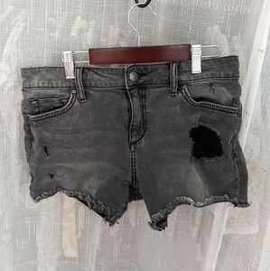 Dark grey distressed denim shorts by Joe's Jeans